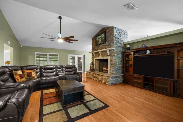 a view of a living room with furniture and a flat screen tv
