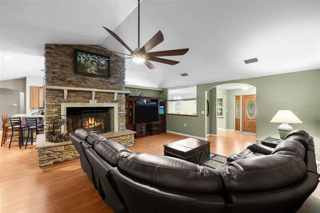 a kitchen with stainless steel appliances a refrigerator sink and cabinets