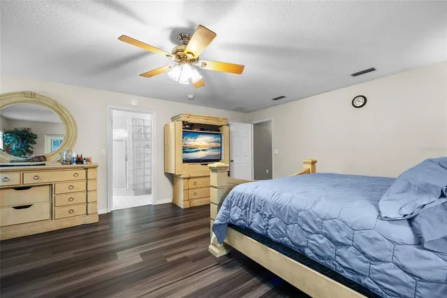 a bathroom with a bathtub sink and mirror
