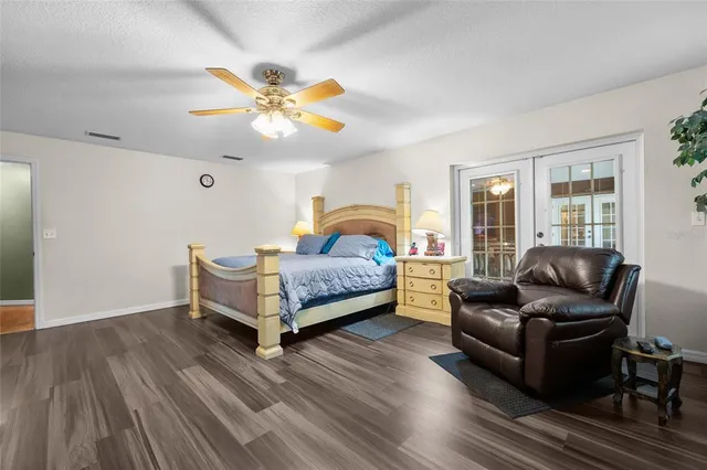 a bathroom with a bathtub sink and mirror
