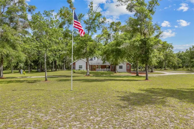 a house view with swimming pool