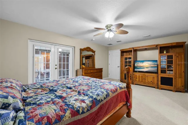 a bathroom with a granite countertop toilet sink and mirror