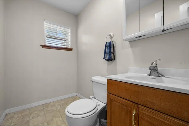 a view of a lake with a house in the background