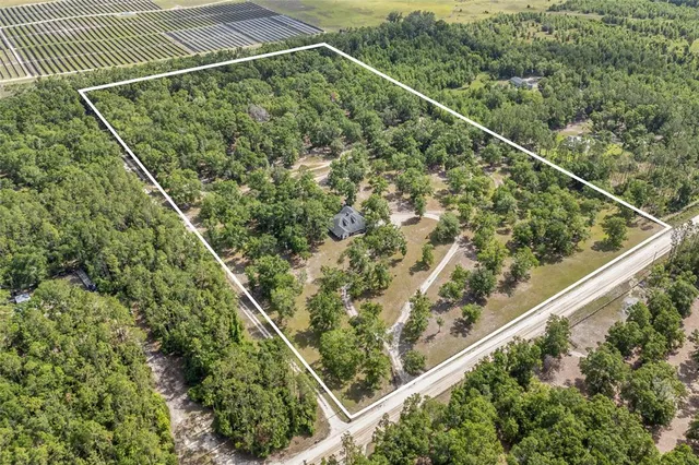 a house view with swimming pool in front of it