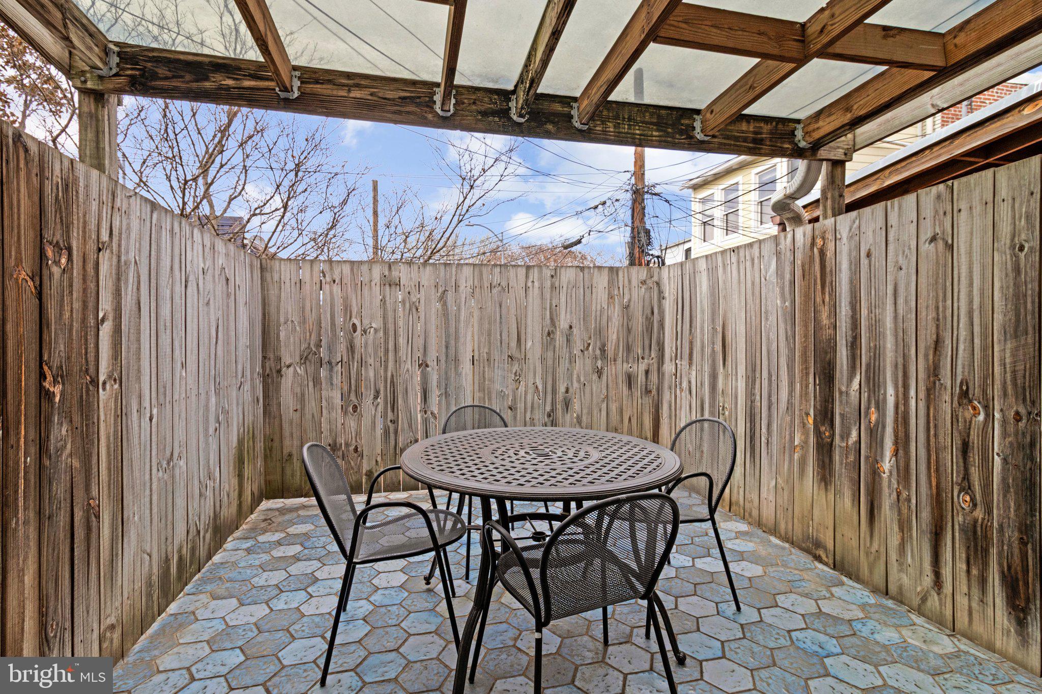 511 2nd Street Southeast Washington, DC 20003 - Photo 16 of 32 Partly covered rear patio w/pretty ceramic tiles.