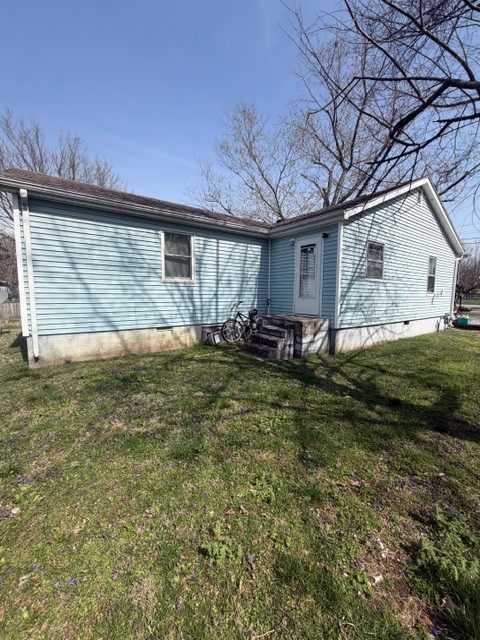 405 South Wooldridge Road Hopkinsville, KY 42240 - Photo 2 of 16 a backyard of a house with yard and outdoor seating