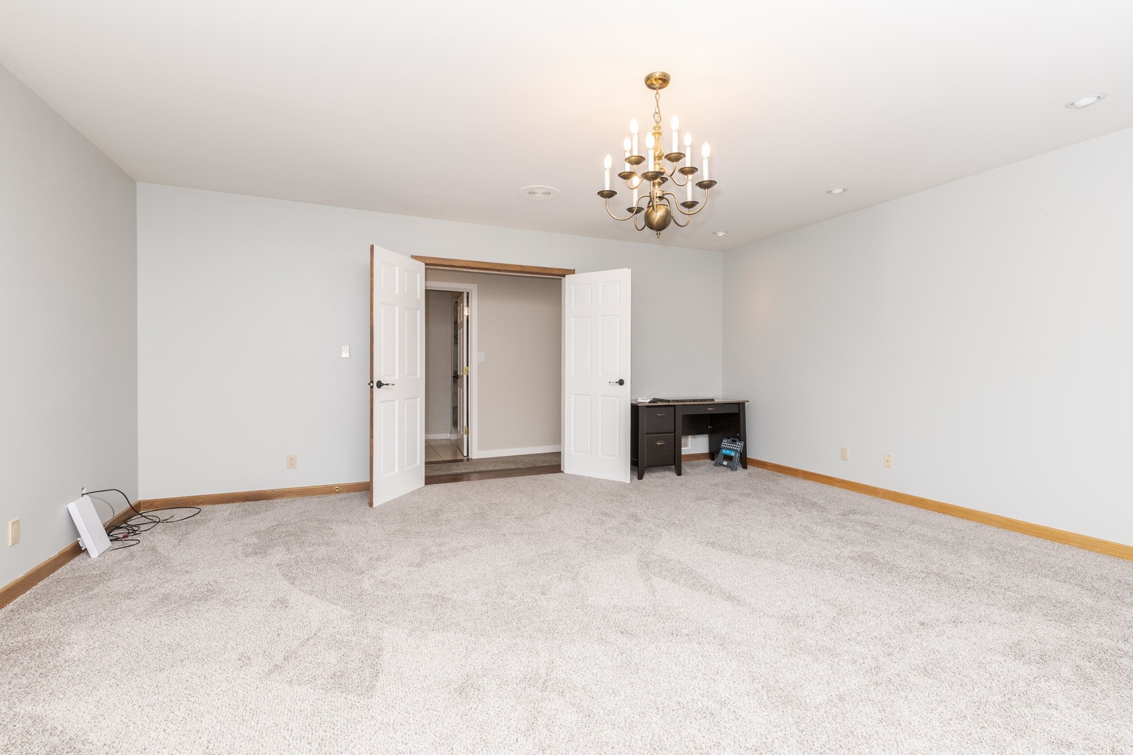 1810 Cardinal Court Pontiac, IL 61764 - Photo 30 of 88 a view of an empty room with a chandelier fan