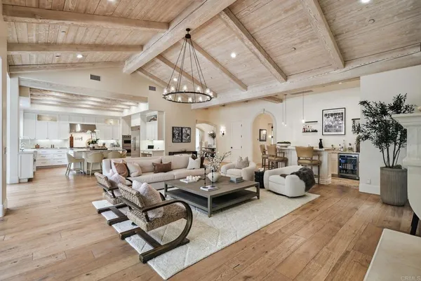 a large kitchen with kitchen island granite countertop a large counter top a sink stainless steel appliances and cabinets