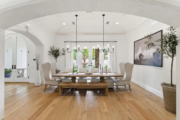 a view of a livingroom with furniture and floor to ceiling window
