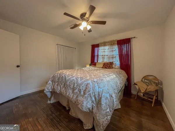 a bedroom with a bed and window
