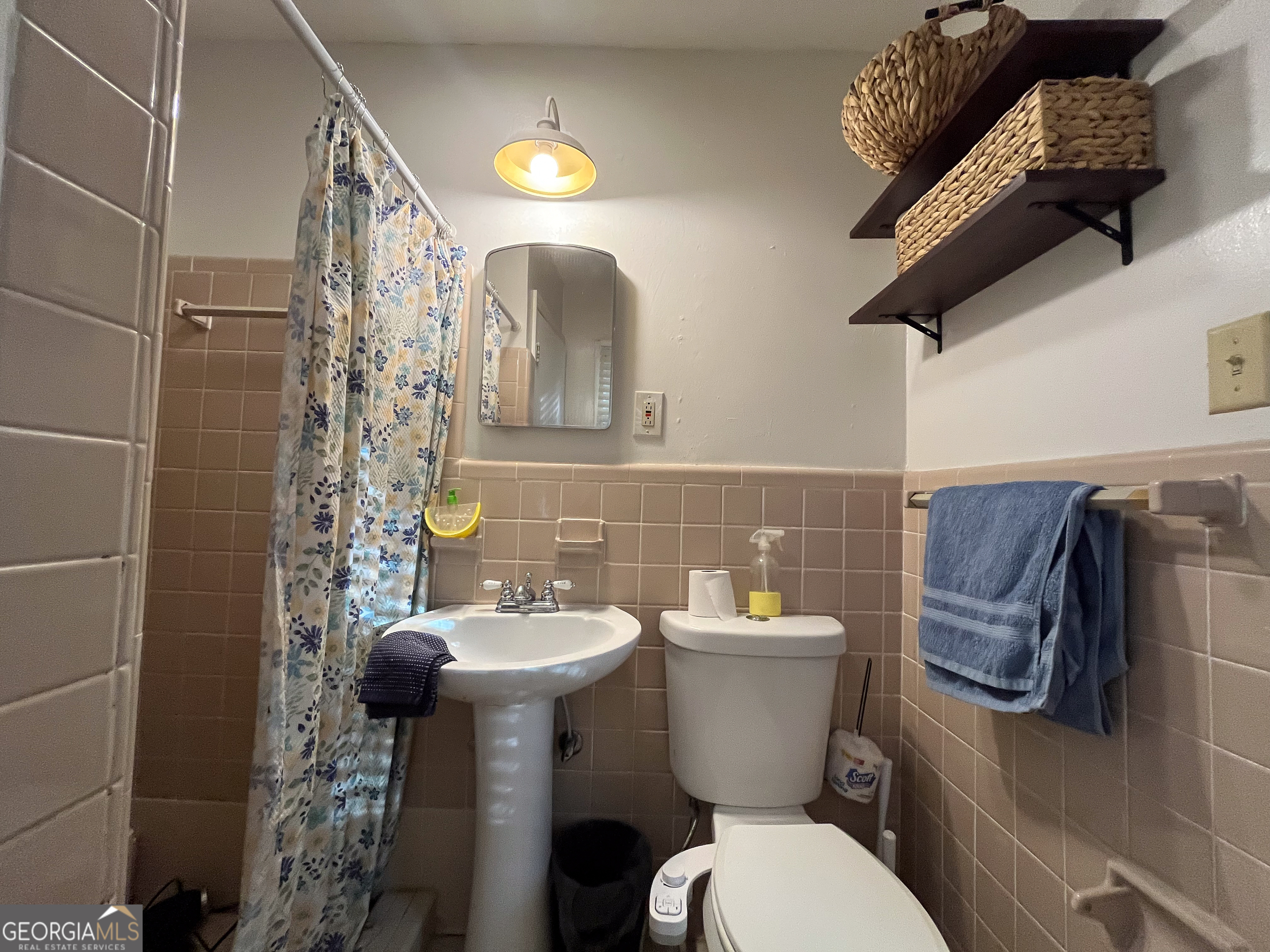218 Pinehurst Drive Dublin, GA 31021 - Photo 17 of 38 a bathroom with a toilet sink and mirror