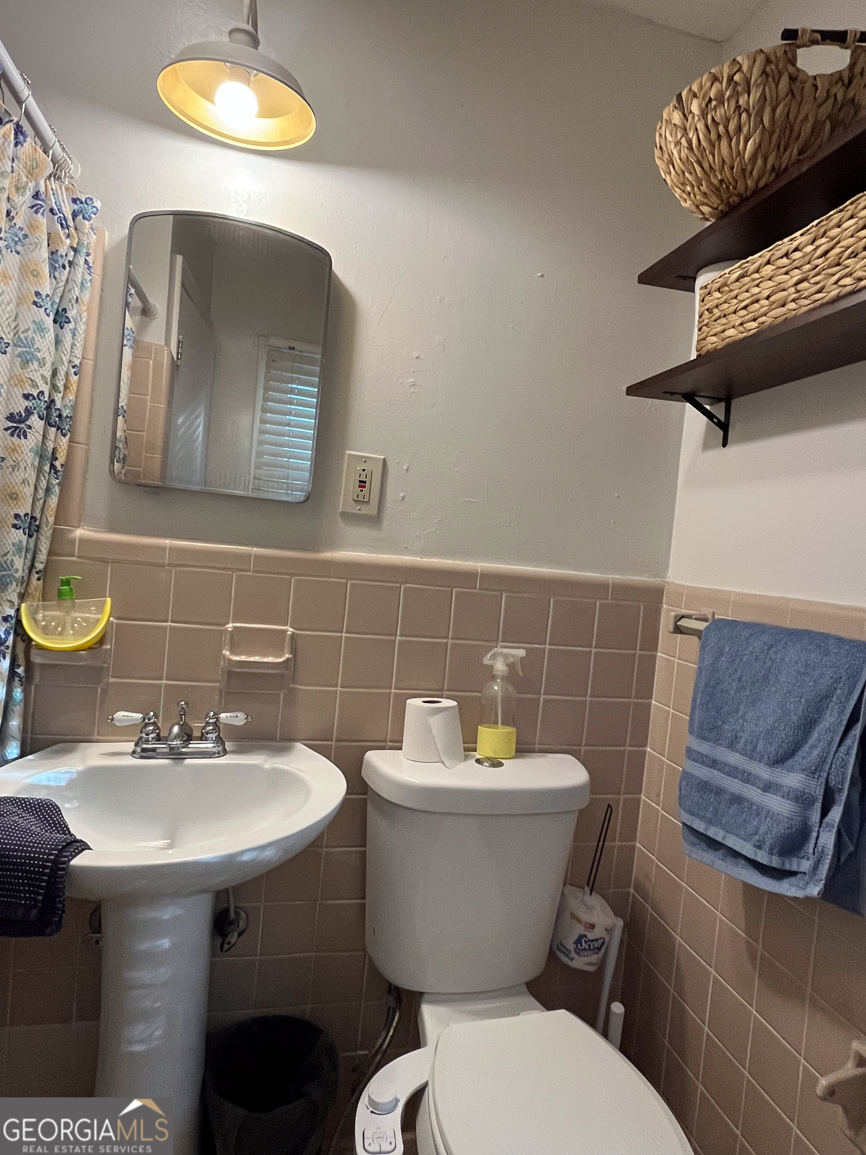 218 Pinehurst Drive Dublin, GA 31021 - Photo 19 of 38 a bathroom with a sink mirror and toilet