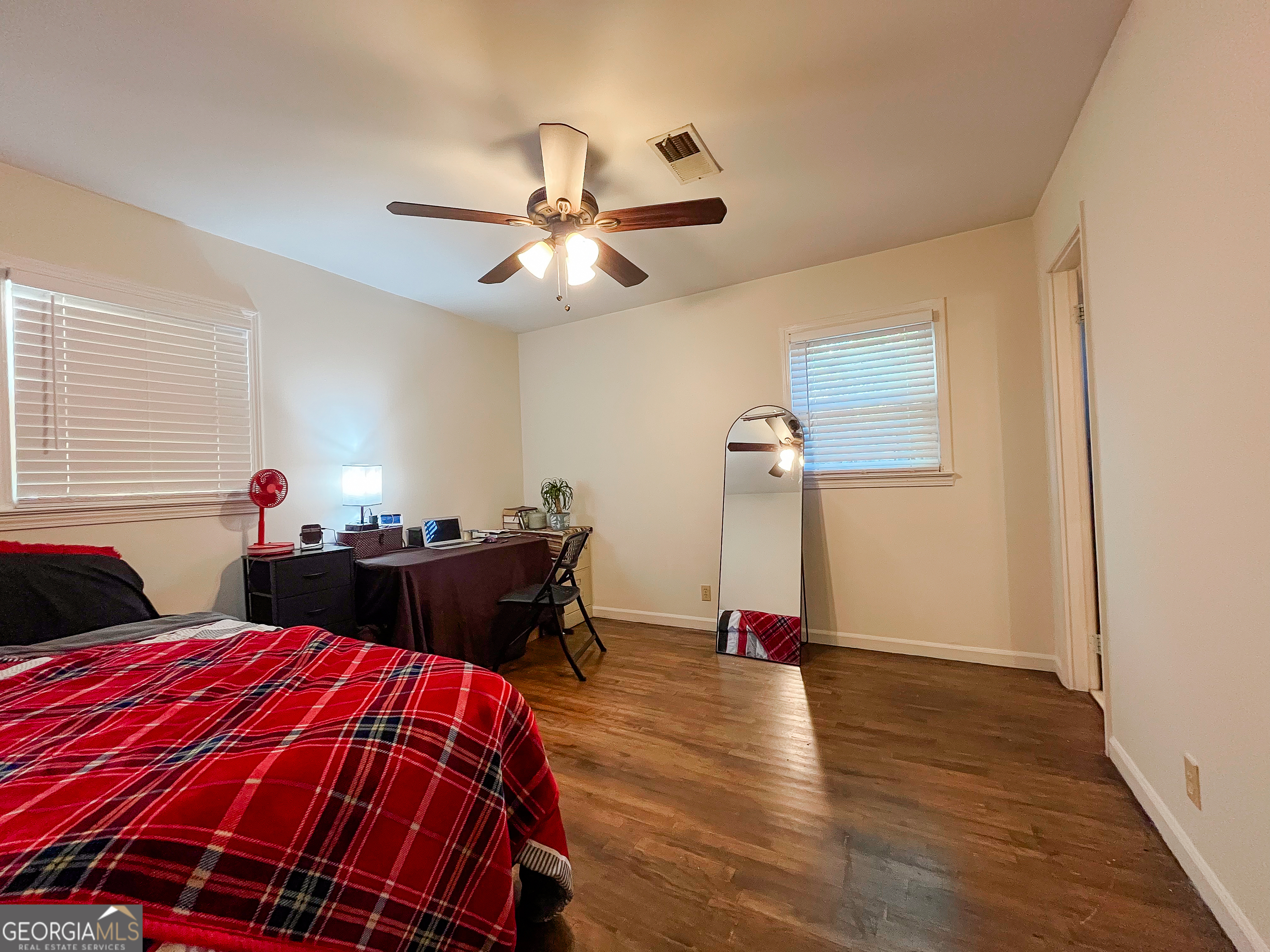 218 Pinehurst Drive Dublin, GA 31021 - Photo 21 of 38 a bed room with a bed and a chandelier