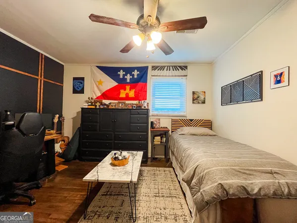 a bed room with a bed and a flat screen tv