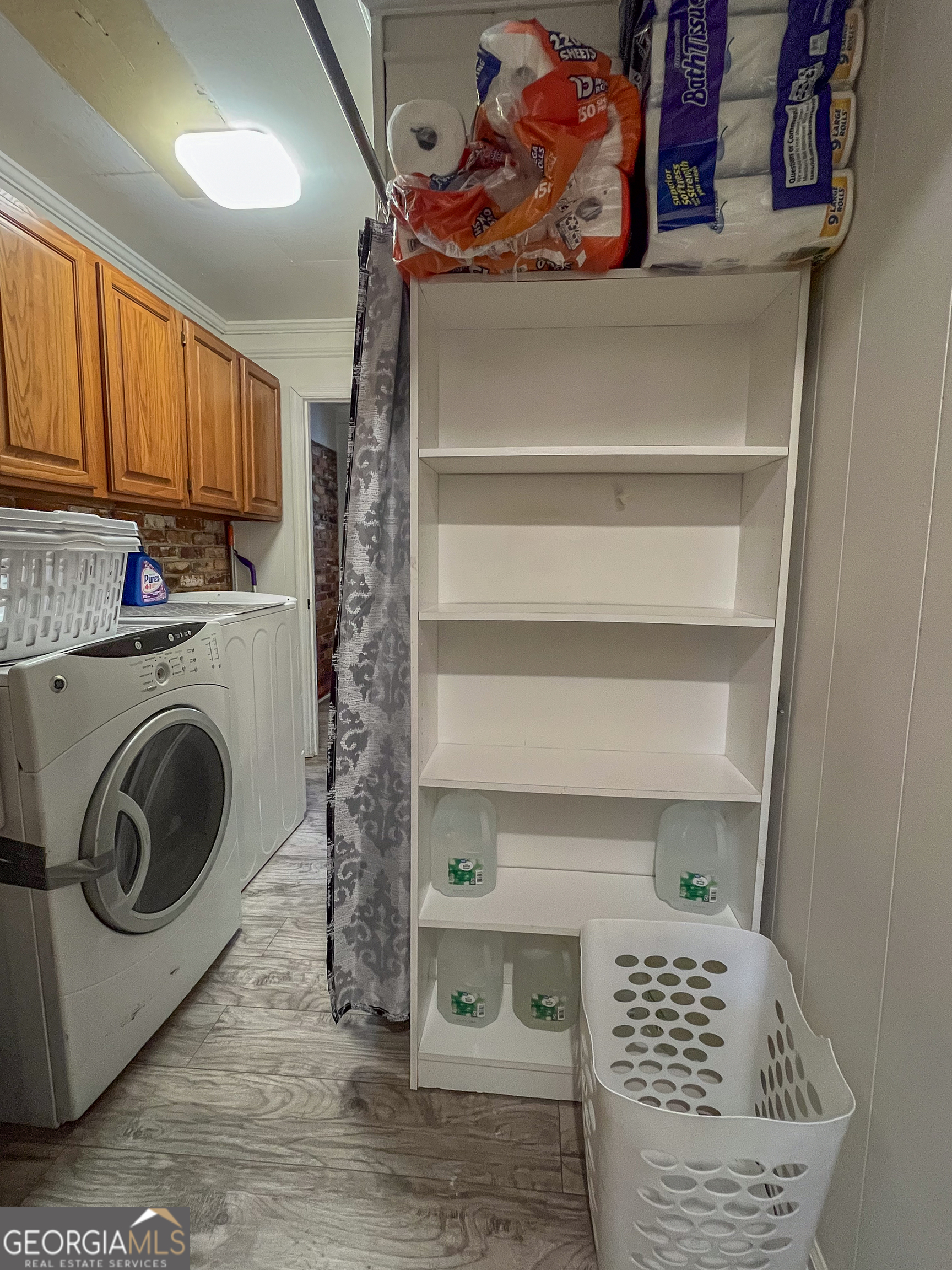 218 Pinehurst Drive Dublin, GA 31021 - Photo 26 of 38 a view of storage and utility room with washer and dryer