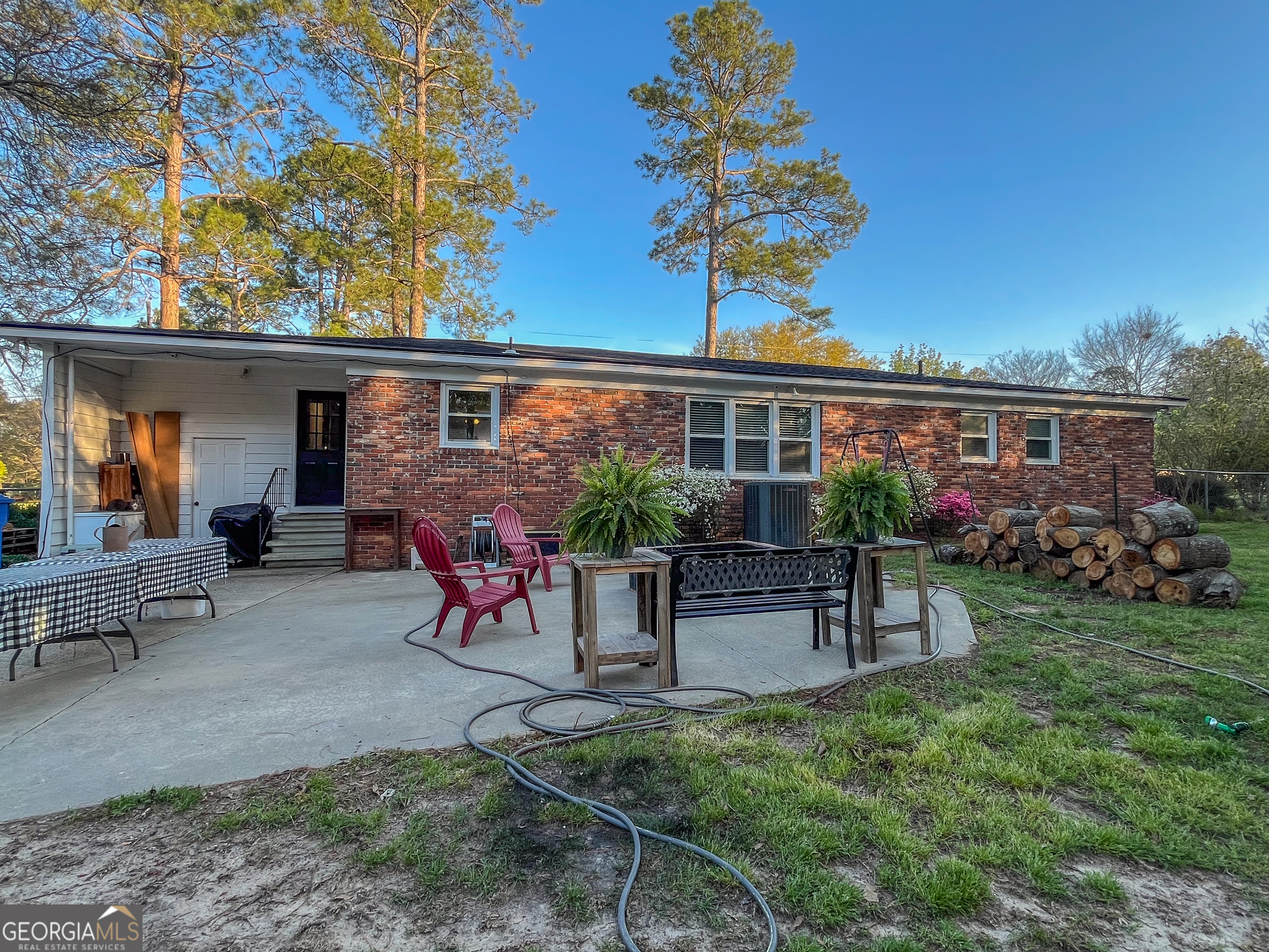 218 Pinehurst Drive Dublin, GA 31021 - Photo 30 of 38 a view of a house with a yard and sitting area