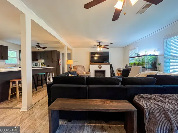 a living room with furniture and a fireplace
