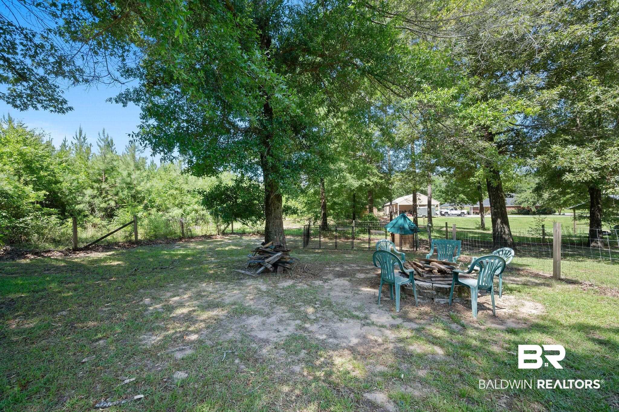 52923 Ammons Road Perdido, AL 36562 - Photo 32 of 35 View of yard with a fire pit