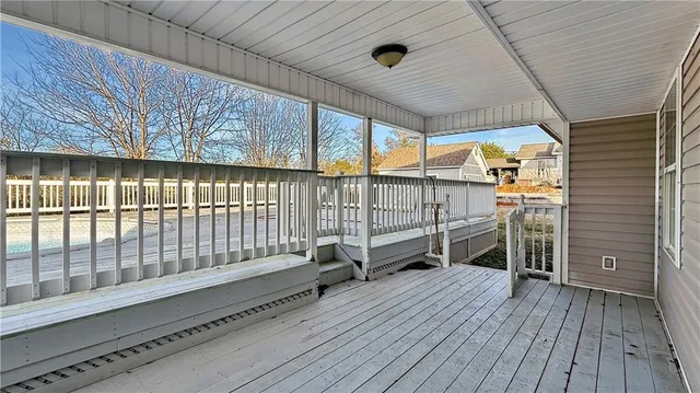 a view of balcony with wooden floor