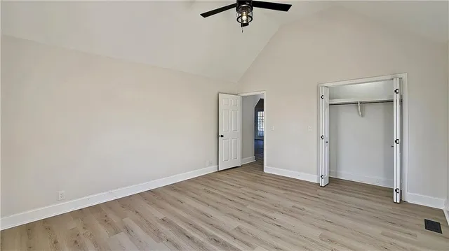 a view of a room with wooden floor