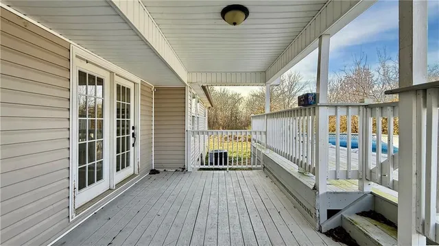 a view of a balcony with wooden floor