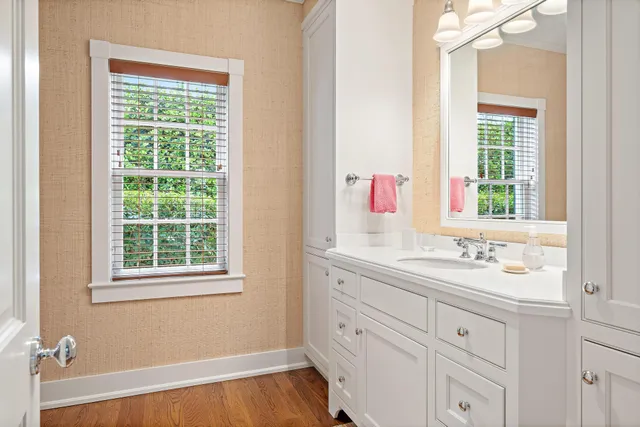 a bathroom with a sink and a window