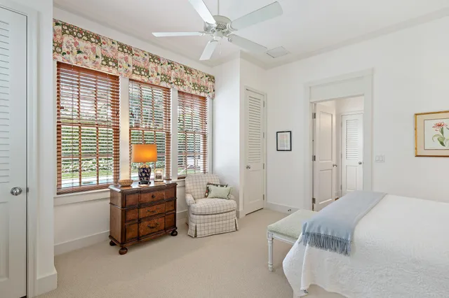 a bedroom with furniture and windows
