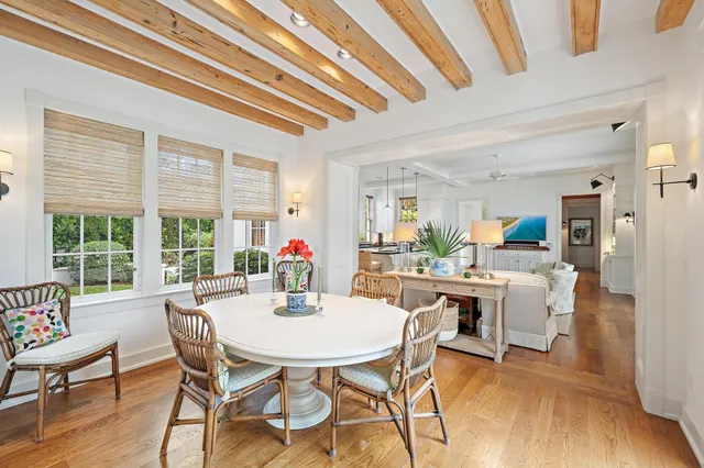 a view of a dining room with furniture window and wooden floor