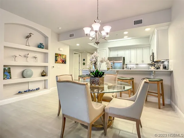 a room with chandelier furniture and a window