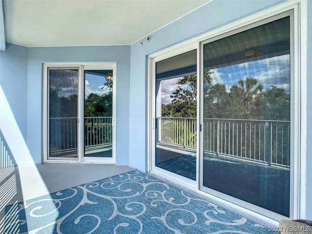 a view of a tree with lots of bushes