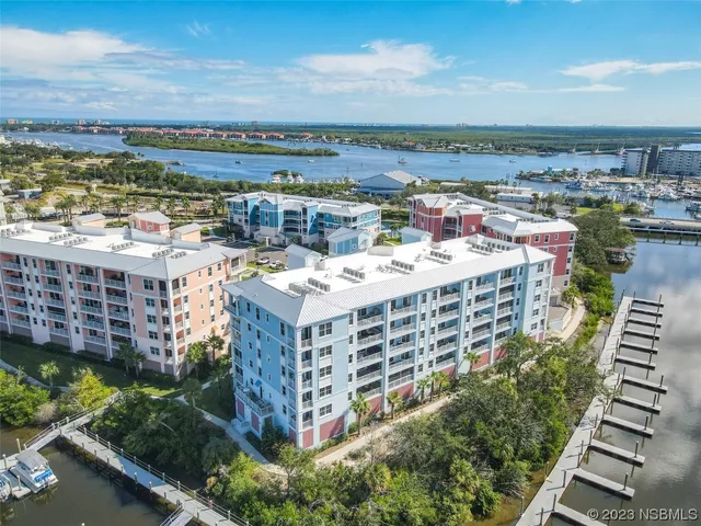 a front view of a building with garden