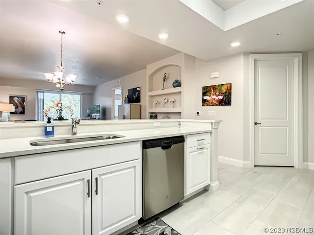 a kitchen with a sink stove and microwave