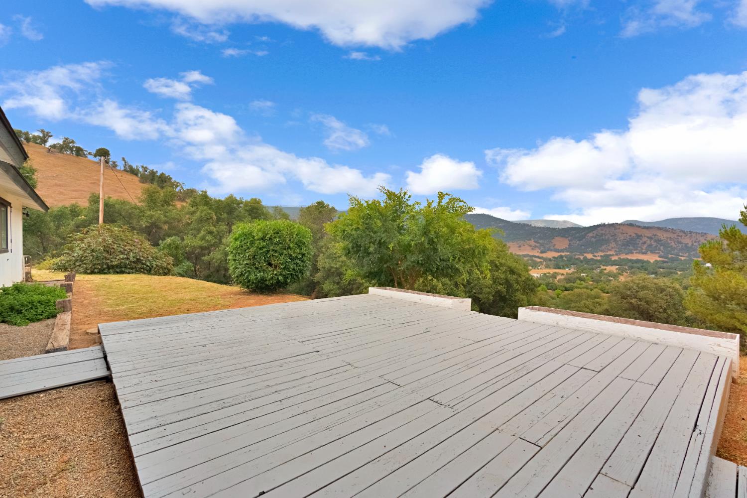 29668 Seminole Road Tollhouse, CA 93667 - Photo 2 of 28 a view of an outdoor space with wooden deck and mountain view