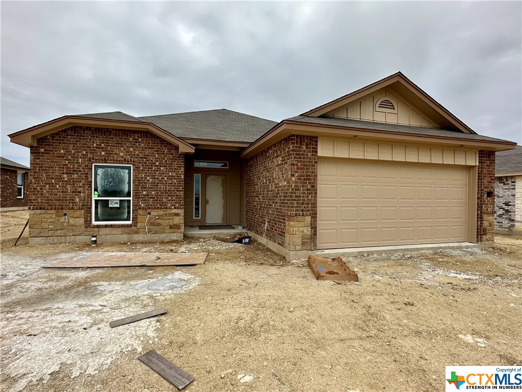 3105 Gryffindor Lane Killeen, TX 76549 - Photo 1 of 1 a front view of a house with a yard and garage