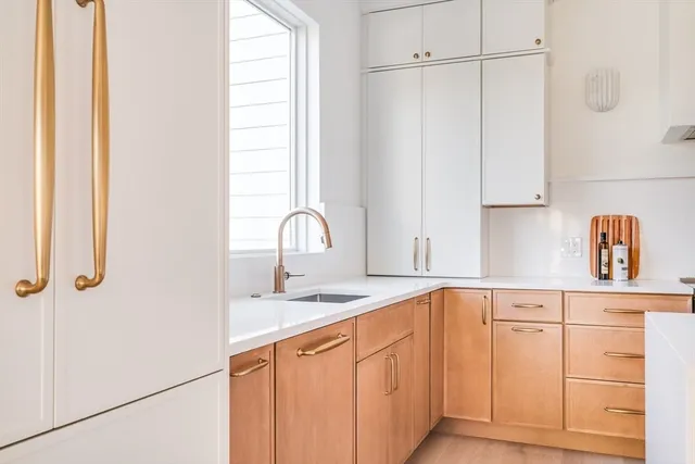 a kitchen with stainless steel appliances granite countertop a sink and a granite counter tops