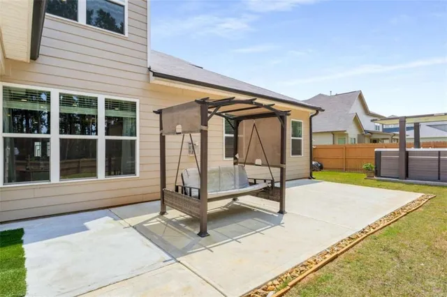 a blue bench sitting in front of a house