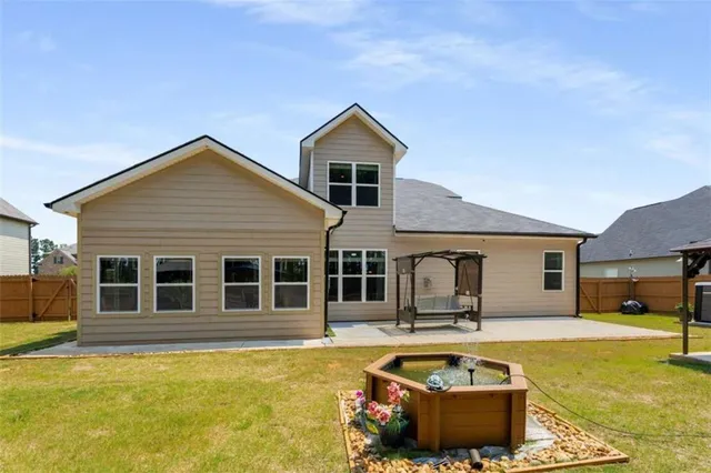 a front view of a house with swimming pool
