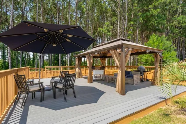a view of chairs and table in the patio