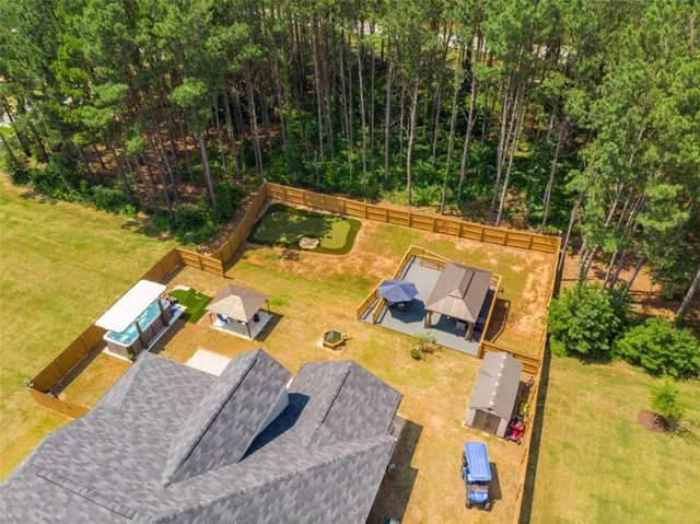 swimming pool view with a garden space