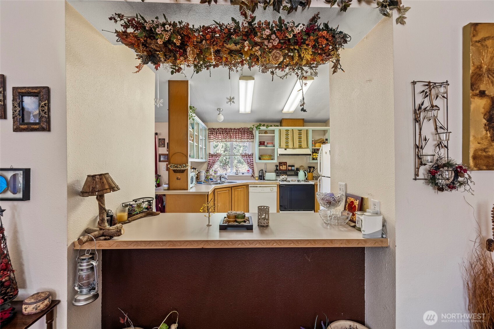 42041 Cedar Street Concrete, WA 98237 - Photo 12 of 33 a dining table with chairs and chandelier