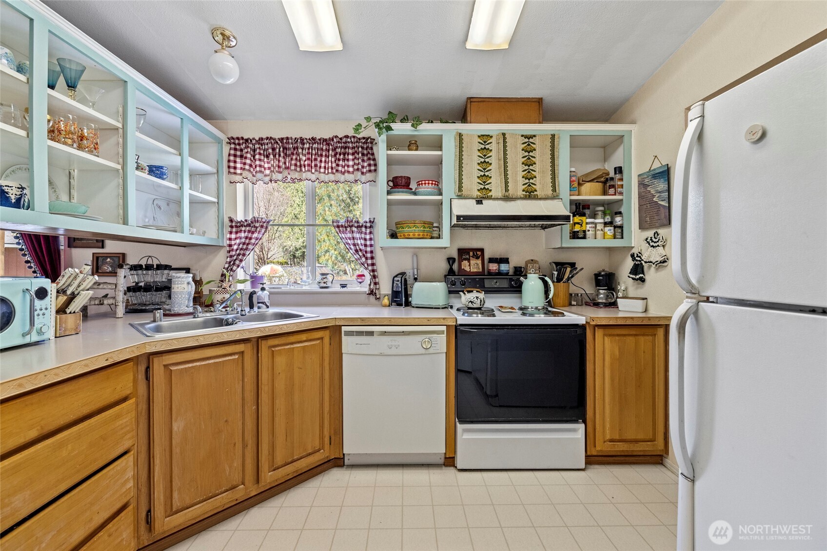 42041 Cedar Street Concrete, WA 98237 - Photo 16 of 33 a kitchen with stainless steel appliances granite countertop a refrigerator and a sink