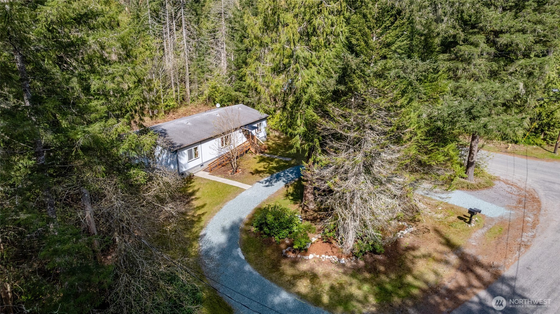 42041 Cedar Street Concrete, WA 98237 - Photo 2 of 33 a view of a house with a yard and green space