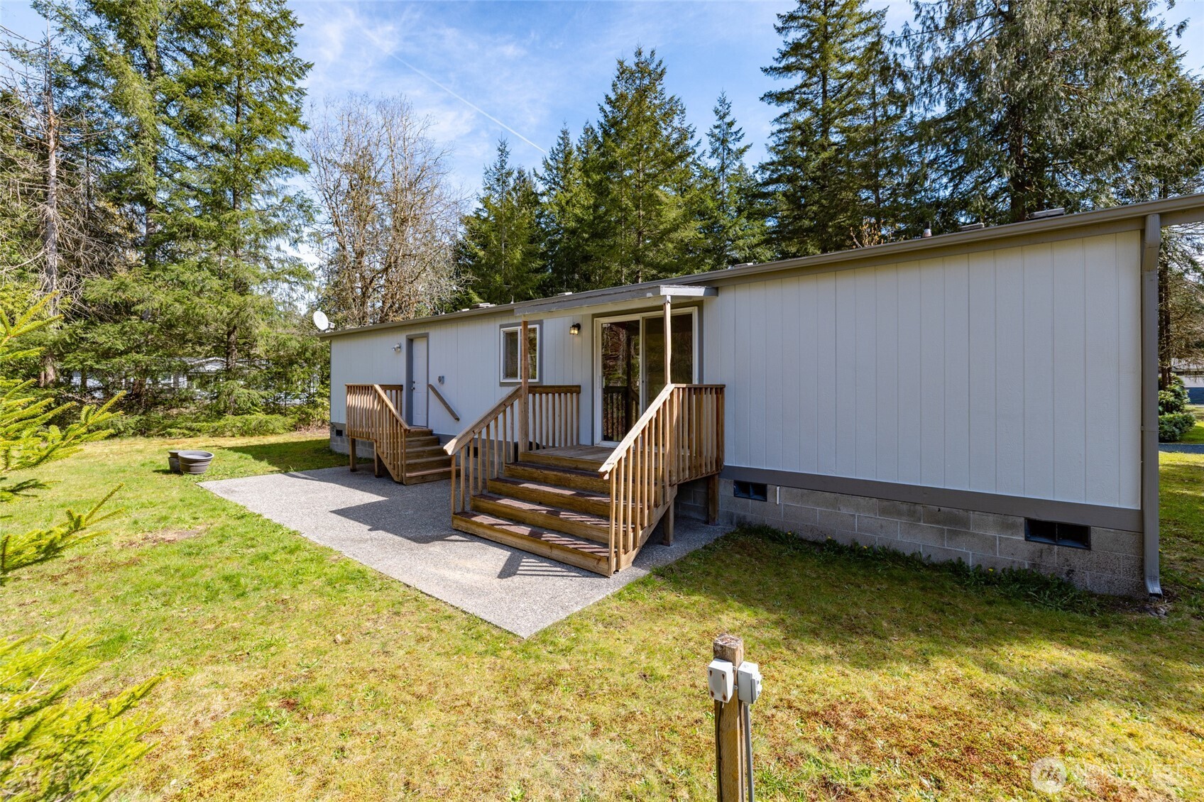 42041 Cedar Street Concrete, WA 98237 - Photo 28 of 33 a view of a small house with swimming pool in front of it