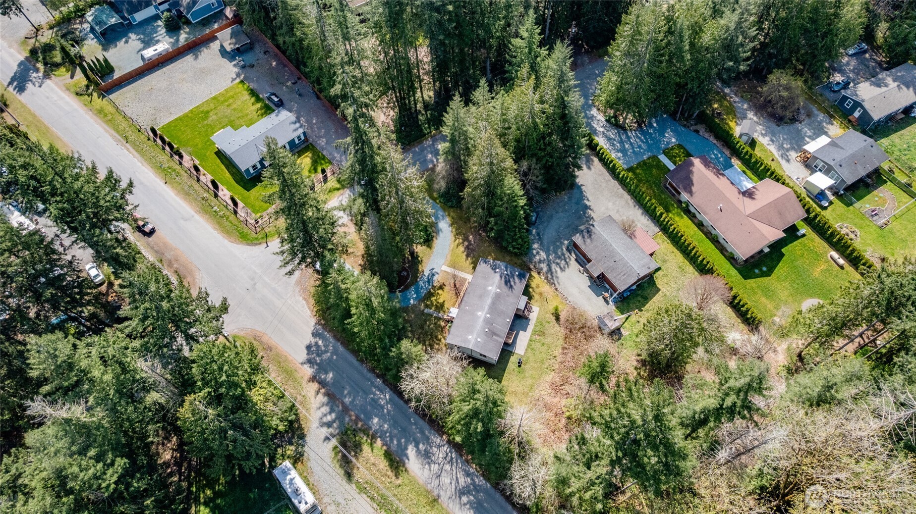 42041 Cedar Street Concrete, WA 98237 - Photo 32 of 33 an aerial view of a house with a yard and swimming pool