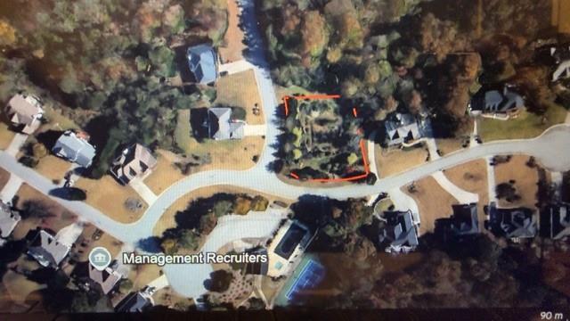 an aerial view of residential house with outdoor space and parking