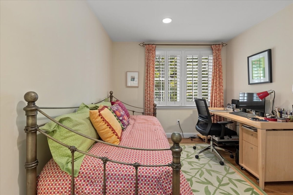 923 Lagrange Street, Unit 923 Boston, MA 02132 - Photo 25 of 32 a bedroom with a bed and a desk