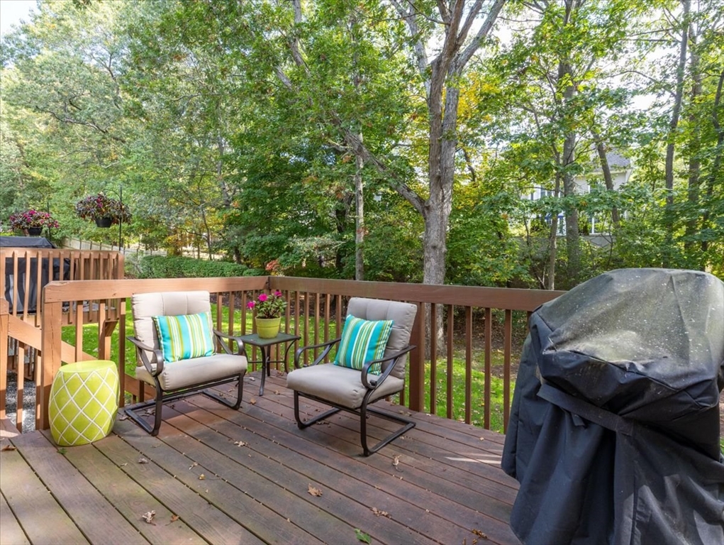 923 Lagrange Street, Unit 923 Boston, MA 02132 - Photo 28 of 32 a view of a deck with furniture and a backyard