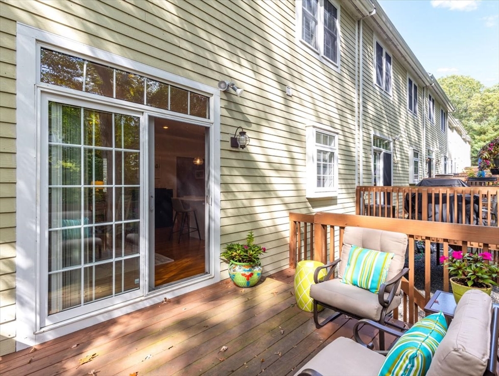 923 Lagrange Street, Unit 923 Boston, MA 02132 - Photo 29 of 32 a view of a deck with couches and potted plants