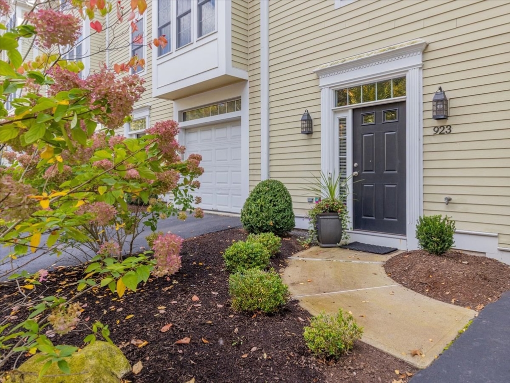 923 Lagrange Street, Unit 923 Boston, MA 02132 - Photo 4 of 32 a front view of a house with garden