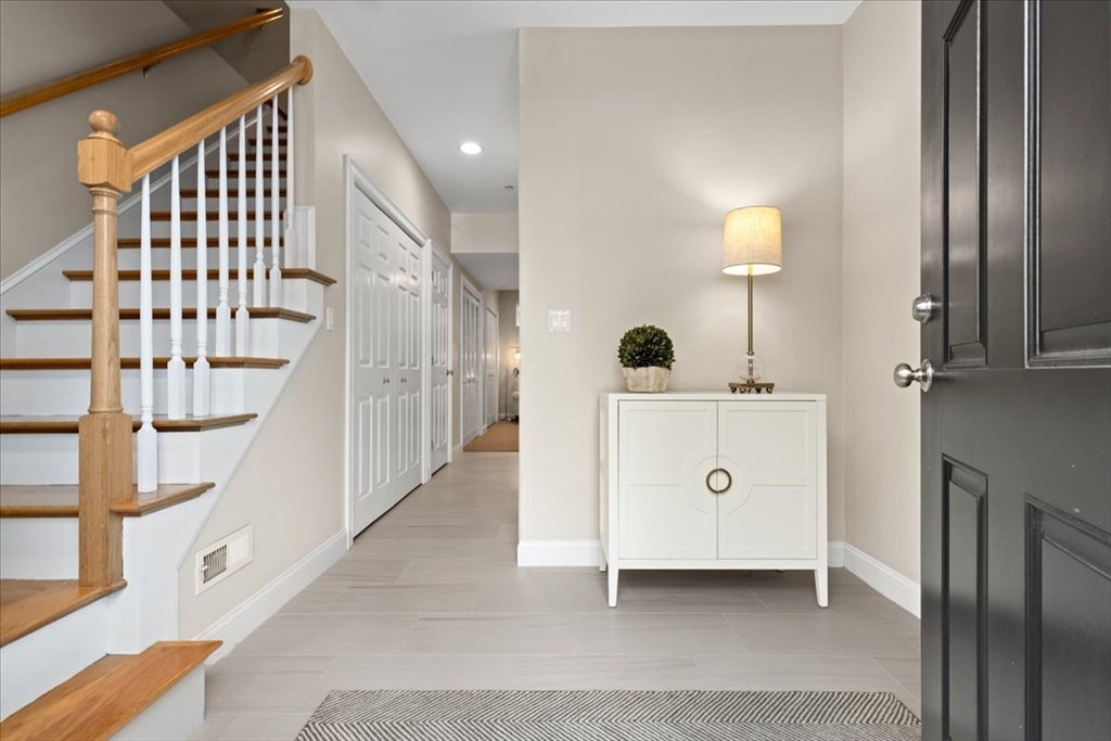 923 Lagrange Street, Unit 923 Boston, MA 02132 - Photo 5 of 32 a spacious bathroom with a double vanity sink and mirror